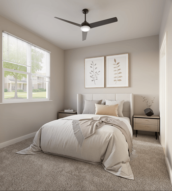 A bedroom with a large bed and a ceiling fan.